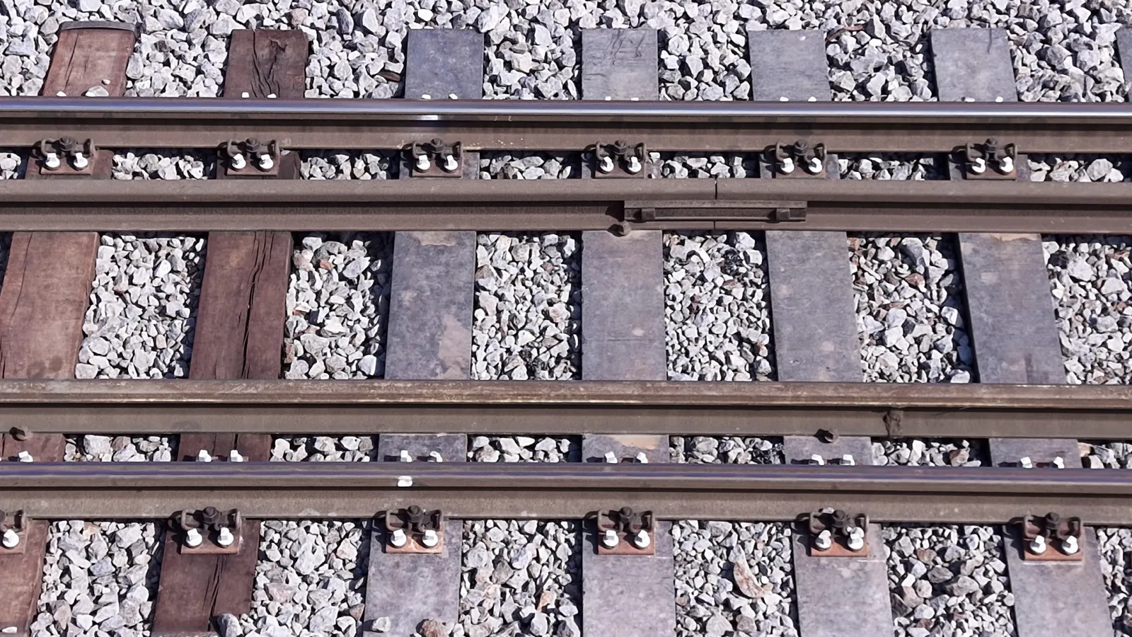 A timber sleeper and a Rerawa composite sleeper side by side on the same track